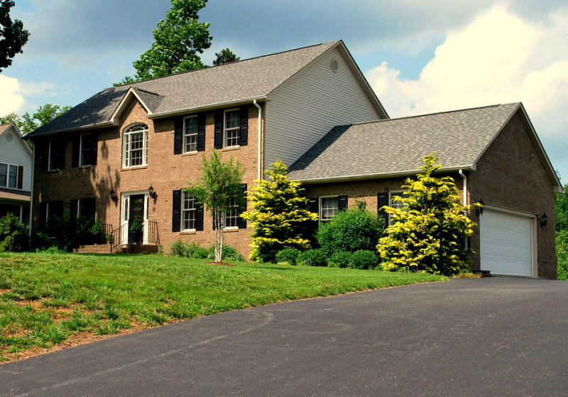 142 Piper Glenn Blue Ridge, VA 24064 - Photo 1 of 46 a front view of a house with a garden and trees