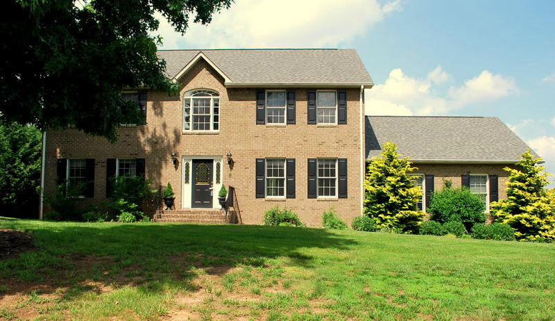 142 Piper Glenn Blue Ridge, VA 24064 - Photo 2 of 46 a front view of a house with a garden and plants