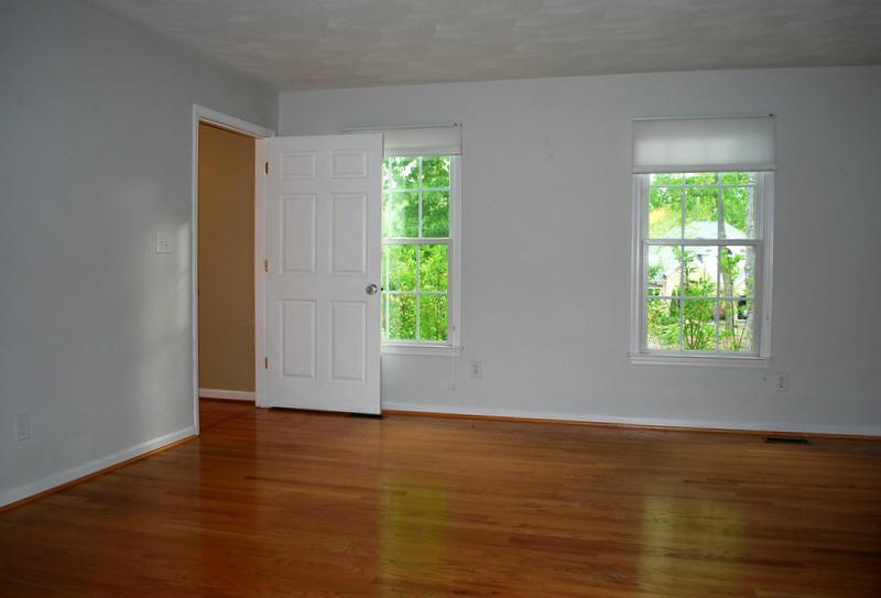 142 Piper Glenn Blue Ridge, VA 24064 - Photo 15 of 46 an empty room with wooden floor and windows