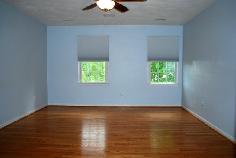 142 Piper Glenn Blue Ridge, VA 24064 - Photo 17 of 46 a view of an empty room with wooden floor and a window