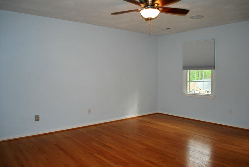 142 Piper Glenn Blue Ridge, VA 24064 - Photo 18 of 46 an empty room with wooden floor and windows