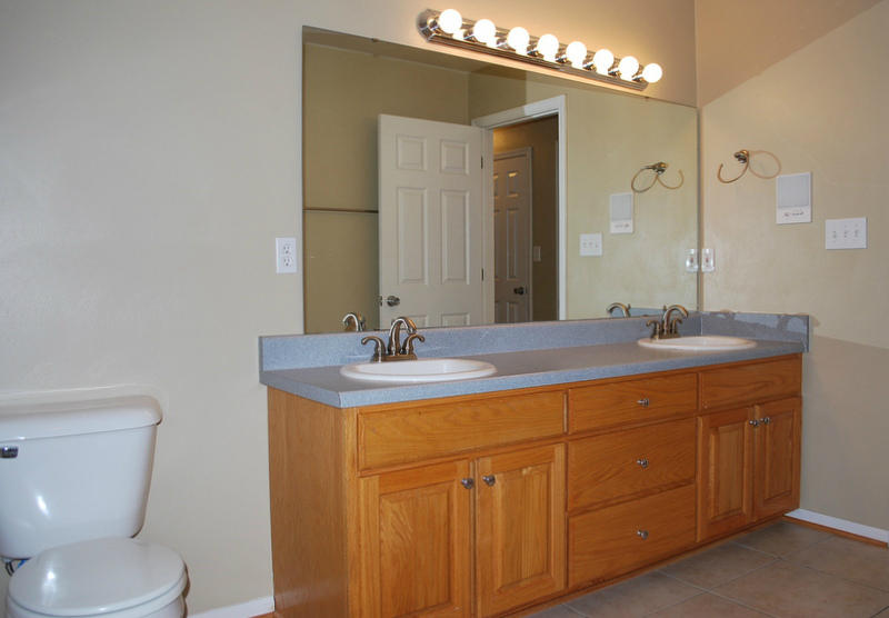 142 Piper Glenn Blue Ridge, VA 24064 - Photo 25 of 46 a bathroom with a granite countertop sink a toilet and a mirror