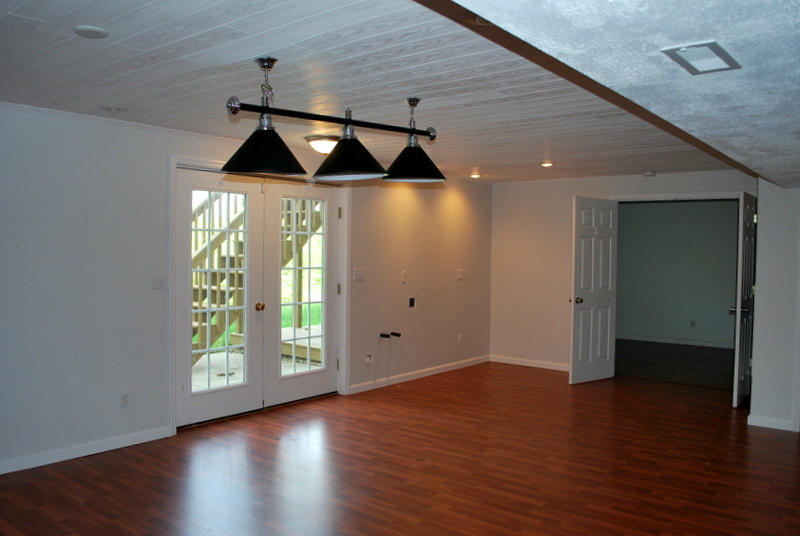142 Piper Glenn Blue Ridge, VA 24064 - Photo 31 of 46 an empty room with wooden floor staircase and windows
