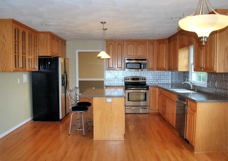 142 Piper Glenn Blue Ridge, VA 24064 - Photo 5 of 46 a kitchen with granite countertop a refrigerator stove top oven and sink