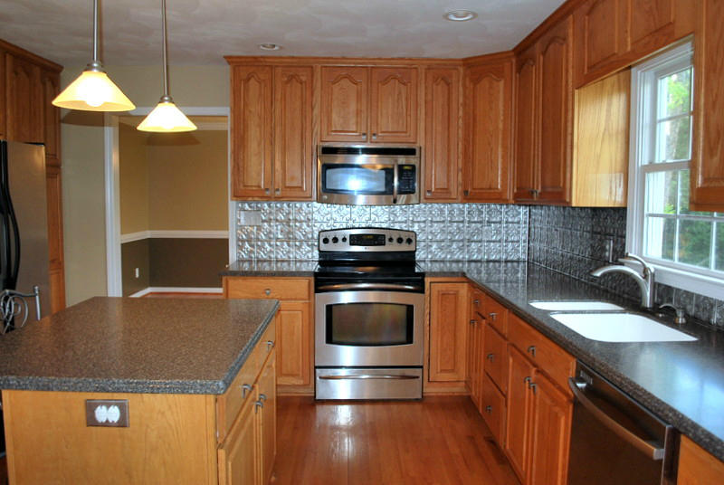 142 Piper Glenn Blue Ridge, VA 24064 - Photo 6 of 46 a kitchen with kitchen island granite countertop a sink stainless steel appliances and cabinets