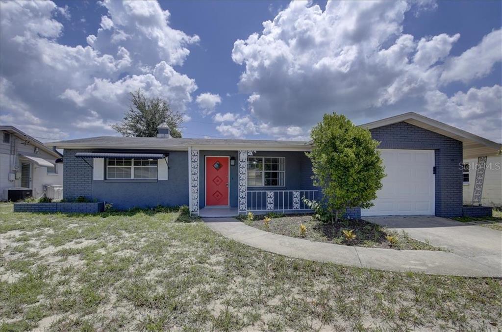 1050 Conoley Lane Holiday, FL 34691 - Photo 1 of 1 a view of a house with a yard and large tree