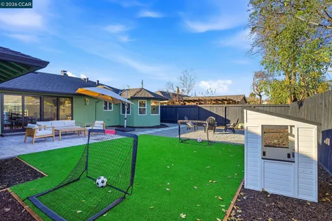 a view of a house with a yard porch and sitting area