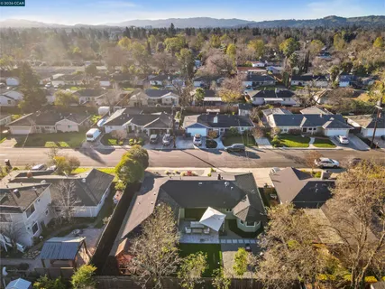 an aerial view of a house with yard