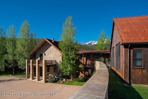 630 Spring Creek Road Basalt, CO 81621 - Photo 12 of 72 a front view of a house with a porch