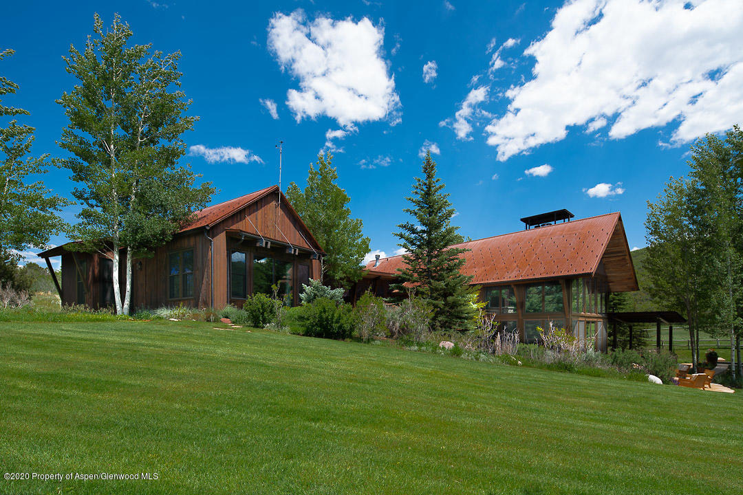 630 Spring Creek Road Basalt, CO 81621 - Photo 16 of 72 a front view of a house with a garden