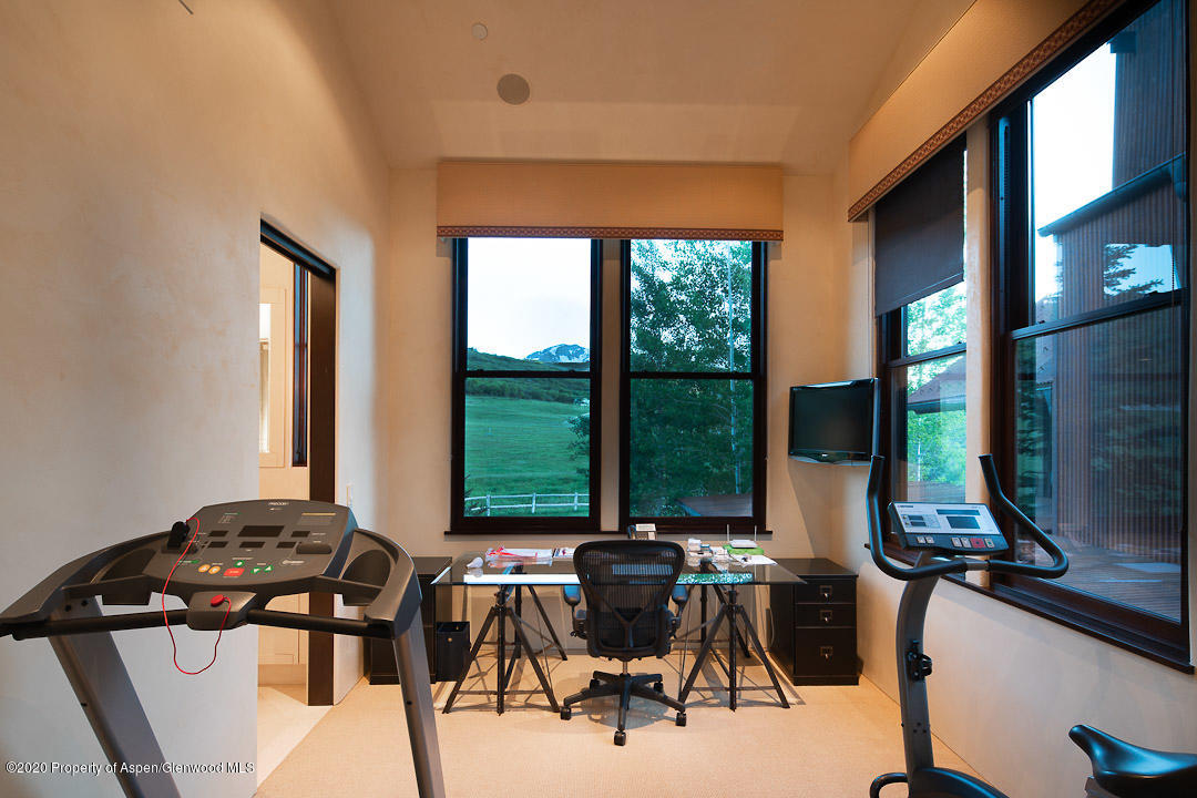 630 Spring Creek Road Basalt, CO 81621 - Photo 27 of 72 a view of a dining room with furniture and a large window