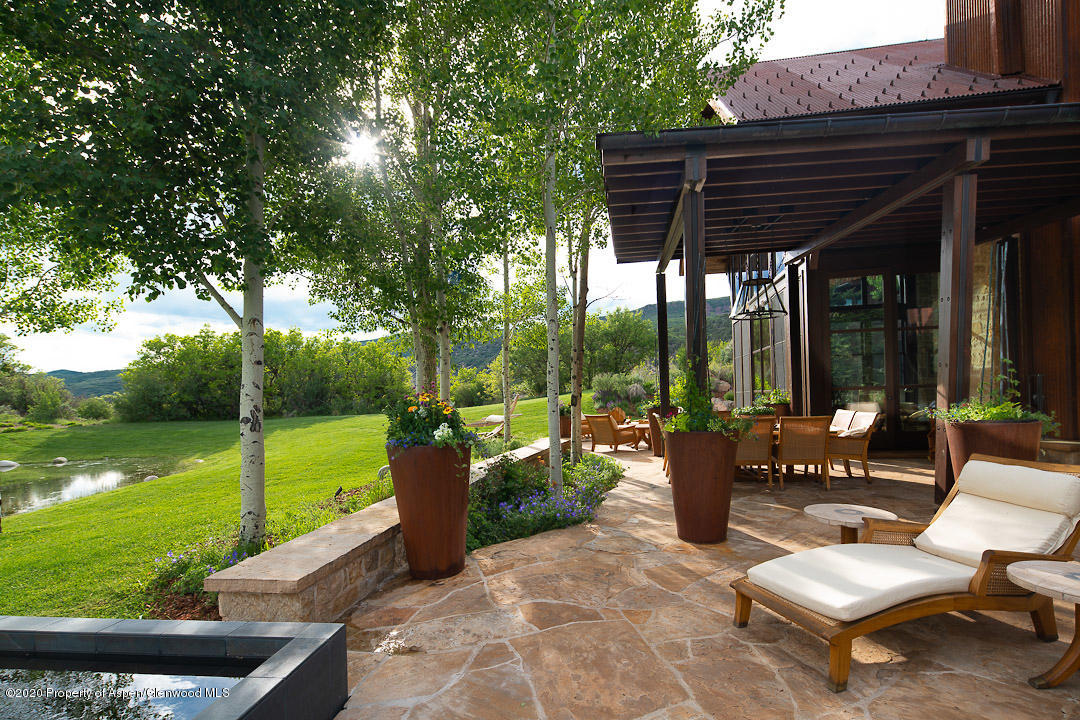 630 Spring Creek Road Basalt, CO 81621 - Photo 30 of 72 a view of a patio with couches chairs and a yard