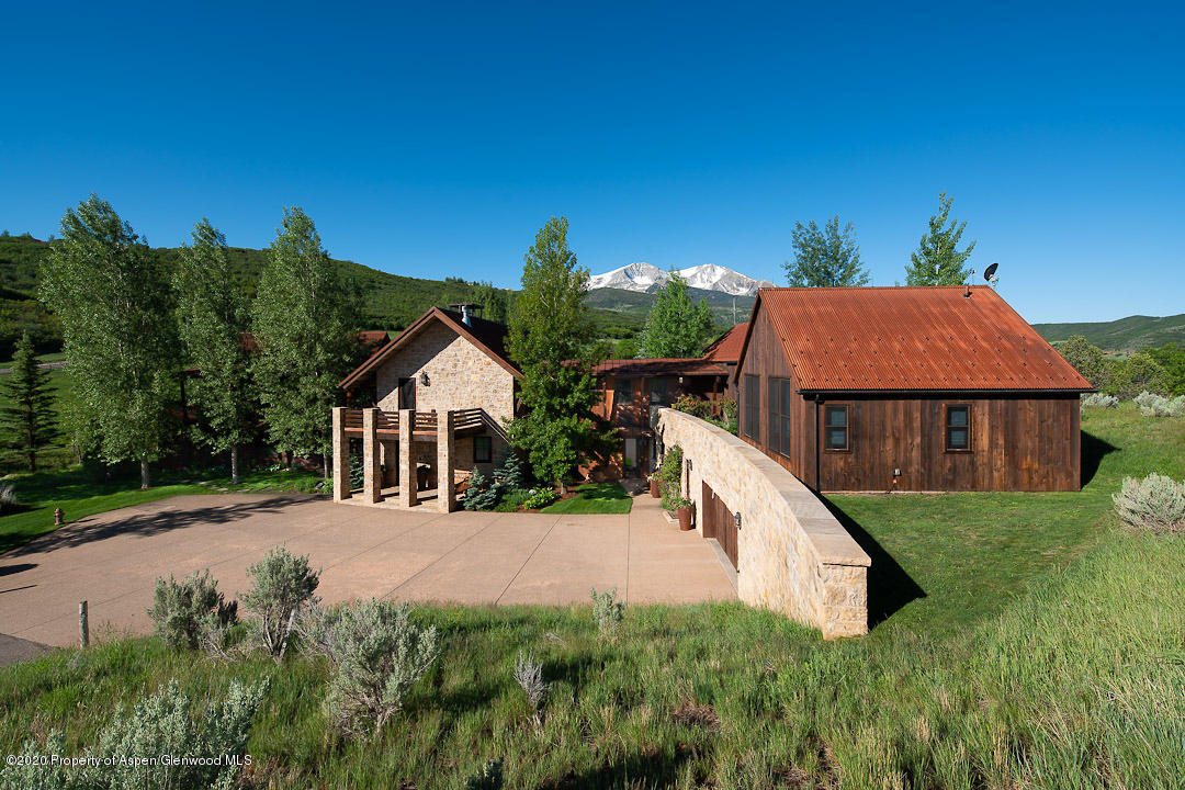 630 Spring Creek Road Basalt, CO 81621 - Photo 31 of 72 a view of a house with a yard
