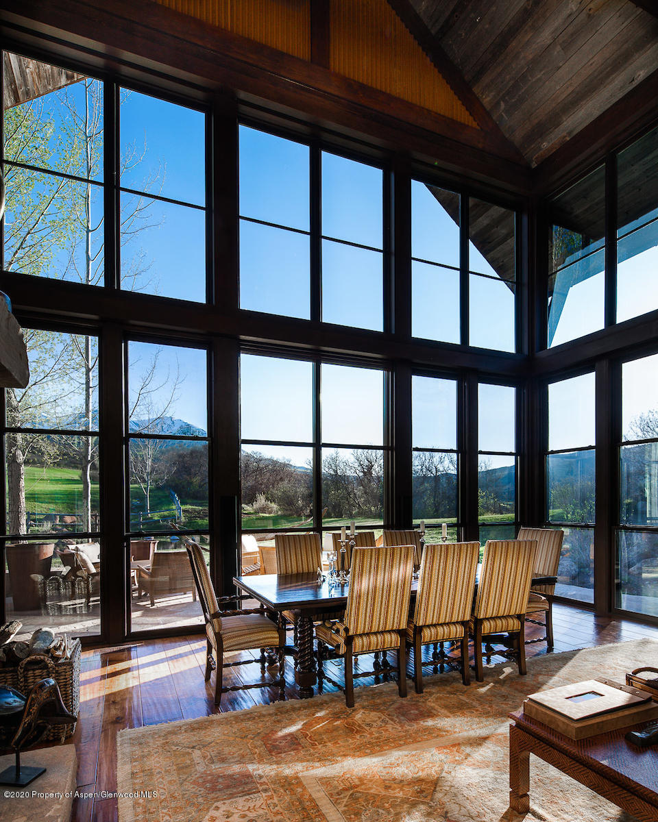 630 Spring Creek Road Basalt, CO 81621 - Photo 57 of 72 a living room with a large window and a table