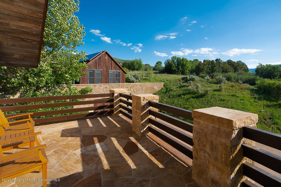 630 Spring Creek Road Basalt, CO 81621 - Photo 68 of 72 a view of a chairs and table in the backyard