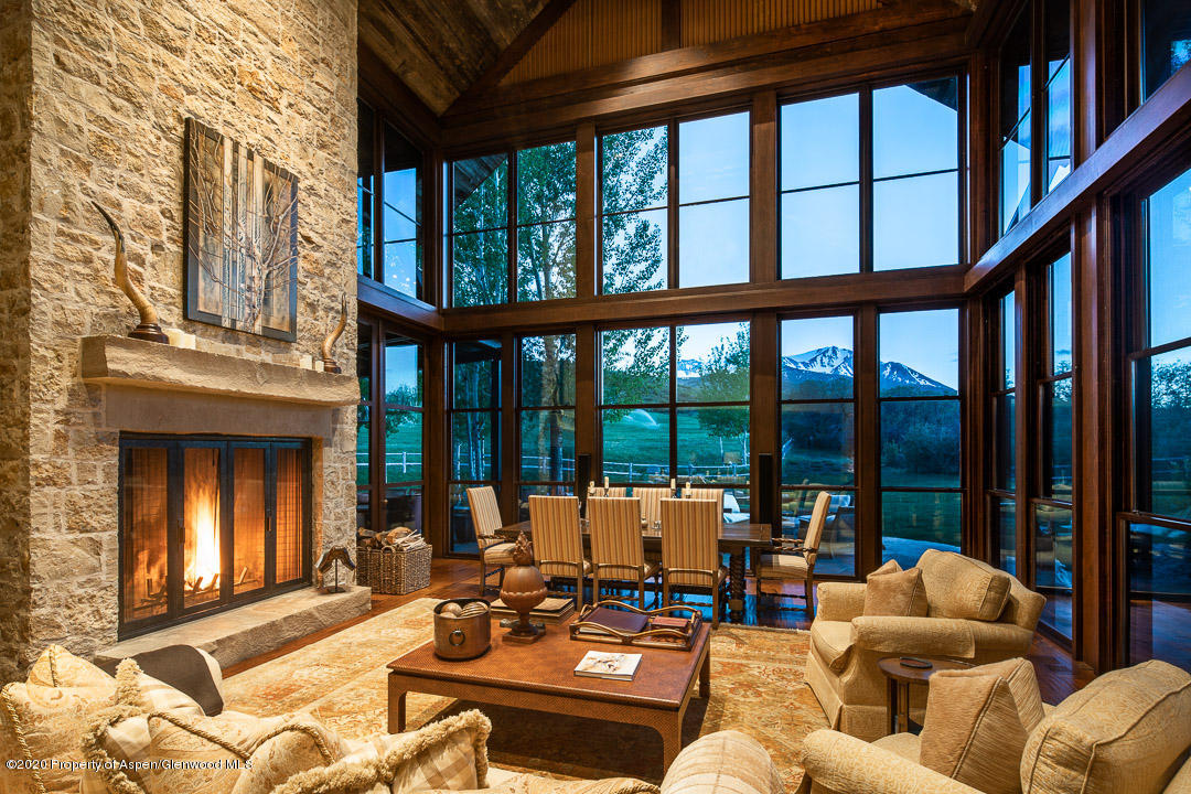 630 Spring Creek Road Basalt, CO 81621 - Photo 8 of 72 a living room with furniture and floor to ceiling windows