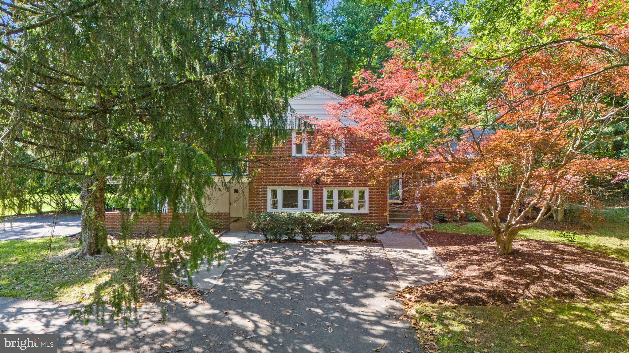 11712 Berwick Road Silver Spring, MD 20904 - Photo 3 of 42 a front view of a house with a yard and tree s