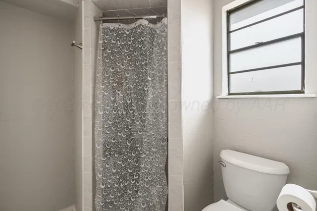 a swimming pool with outdoor seating and yard