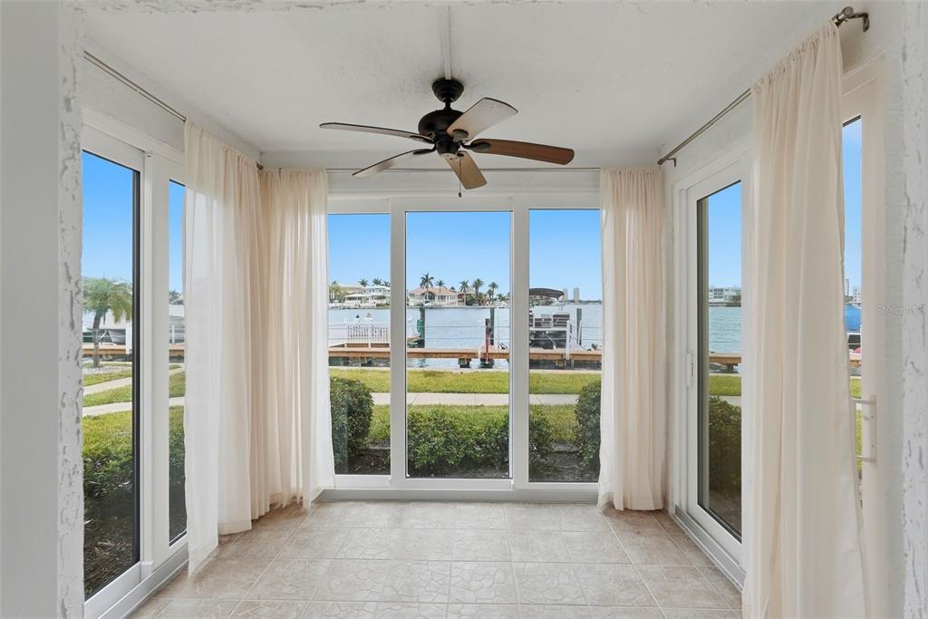 8921 Blind Pass Road, Unit 144 St. Pete Beach, FL 33706 - Photo 15 of 37 a view of a kitchen with a sink and a window