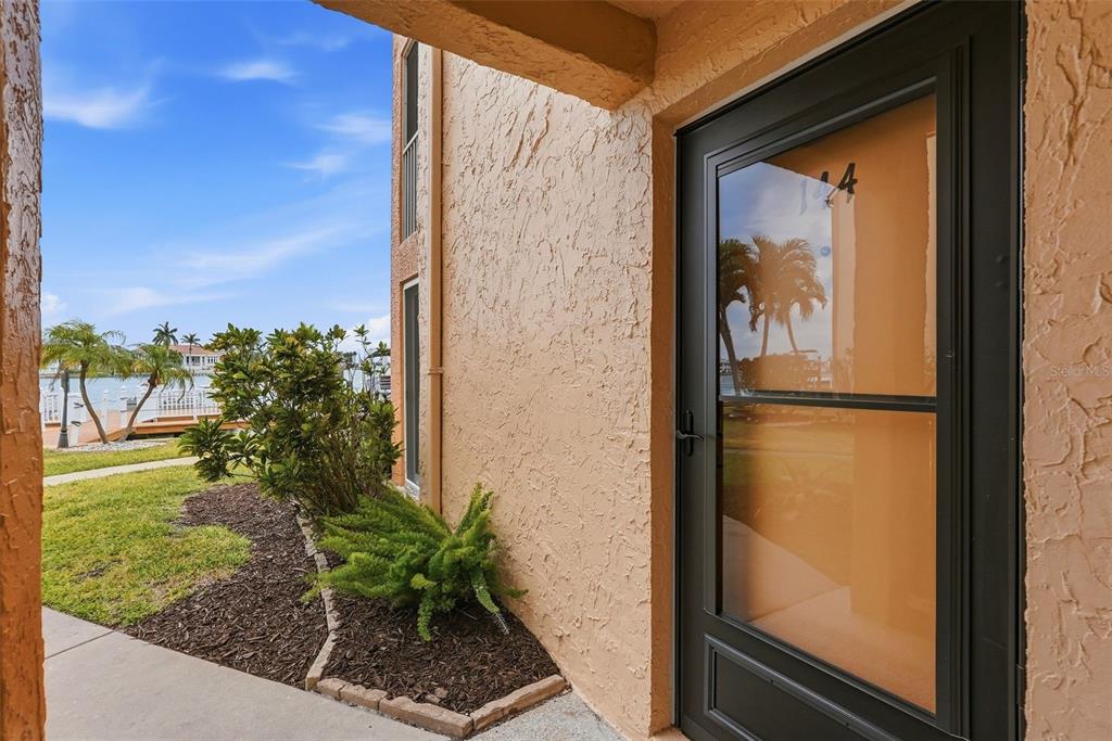 8921 Blind Pass Road, Unit 144 St. Pete Beach, FL 33706 - Photo 19 of 37 a view of a door and a window