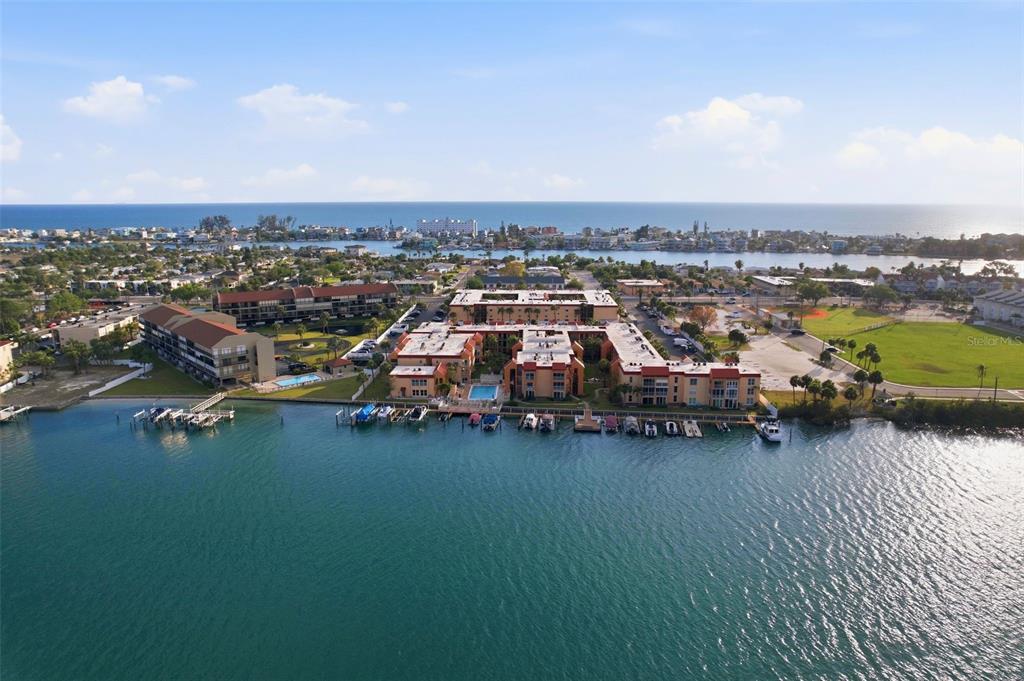 8921 Blind Pass Road, Unit 144 St. Pete Beach, FL 33706 - Photo 20 of 37 an aerial view of a houses with city view