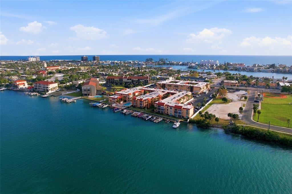 8921 Blind Pass Road, Unit 144 St. Pete Beach, FL 33706 - Photo 21 of 37 an aerial view of residential houses with outdoor space