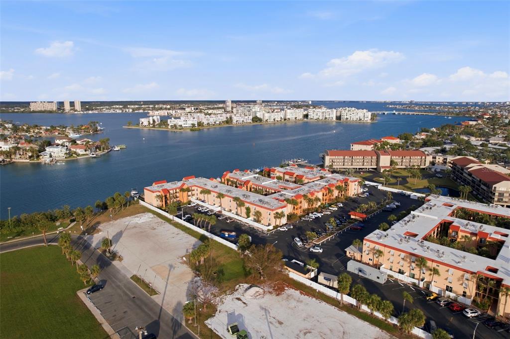 8921 Blind Pass Road, Unit 144 St. Pete Beach, FL 33706 - Photo 23 of 37 an aerial view of a houses with ocean view