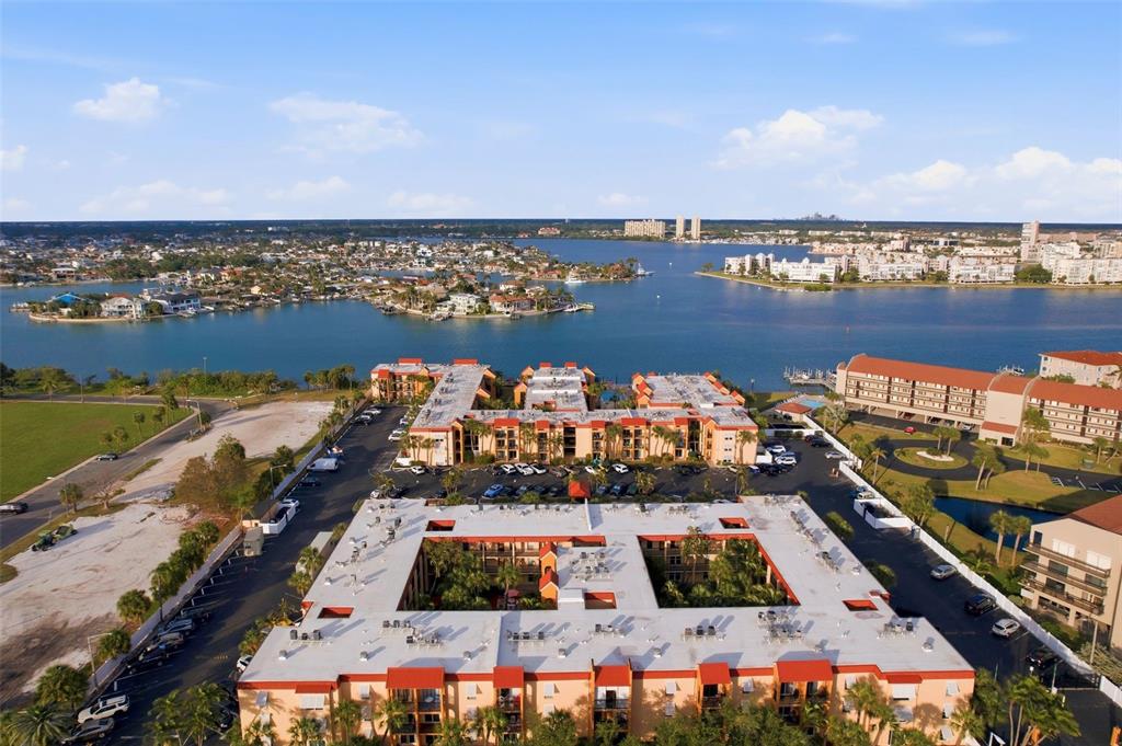 8921 Blind Pass Road, Unit 144 St. Pete Beach, FL 33706 - Photo 24 of 37 an aerial view of residential houses with outdoor space