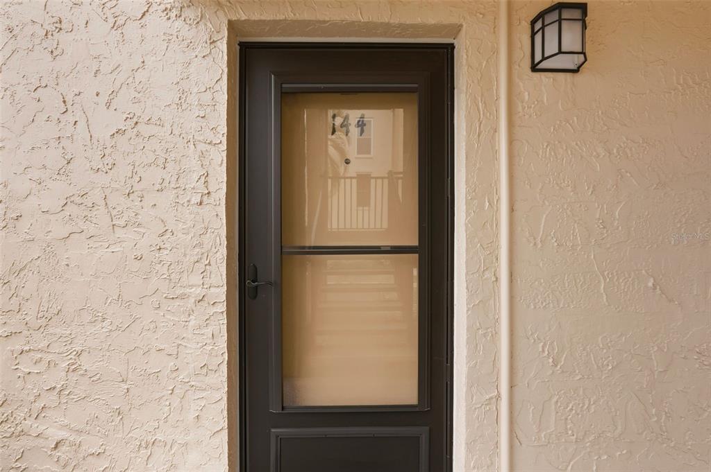 8921 Blind Pass Road, Unit 144 St. Pete Beach, FL 33706 - Photo 28 of 37 a view of front door