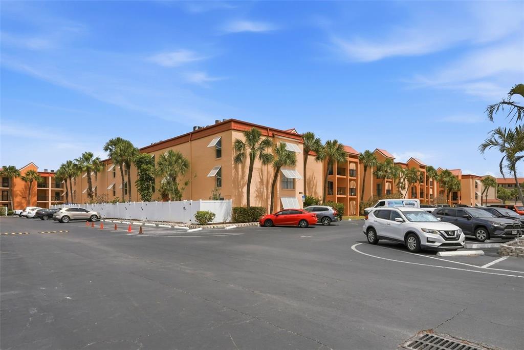 8921 Blind Pass Road, Unit 144 St. Pete Beach, FL 33706 - Photo 35 of 37 a view of a street with cars on the road