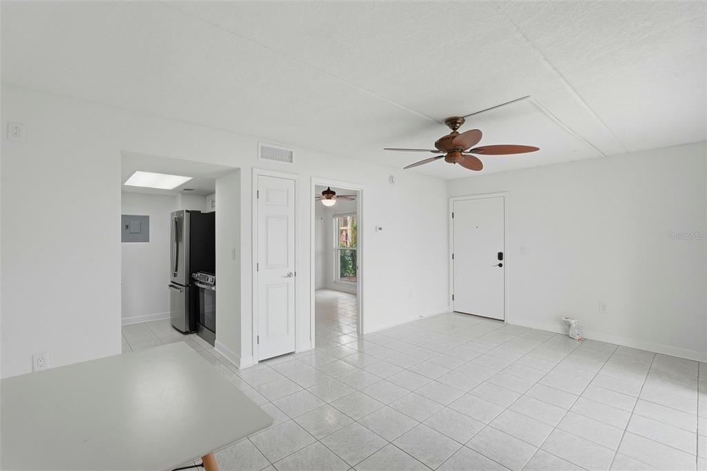 8921 Blind Pass Road, Unit 144 St. Pete Beach, FL 33706 - Photo 8 of 37 an empty room with closet and a ceiling fan