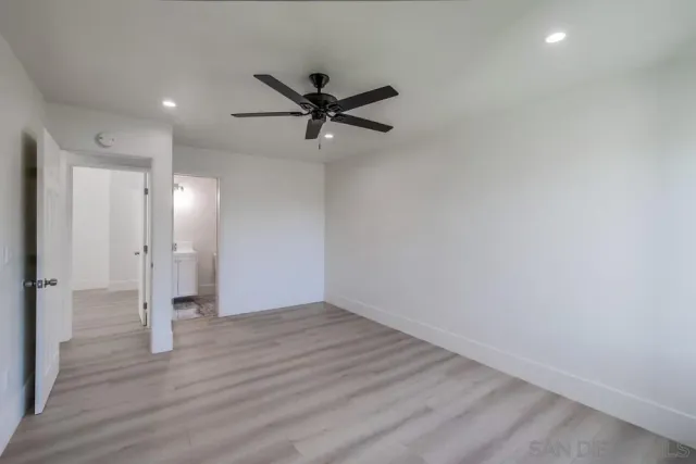 a white toilet sitting next to a bathroom sink