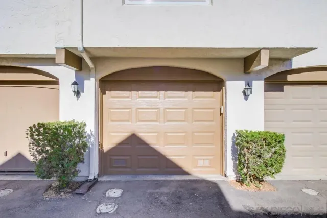 an empty room with closet and windows