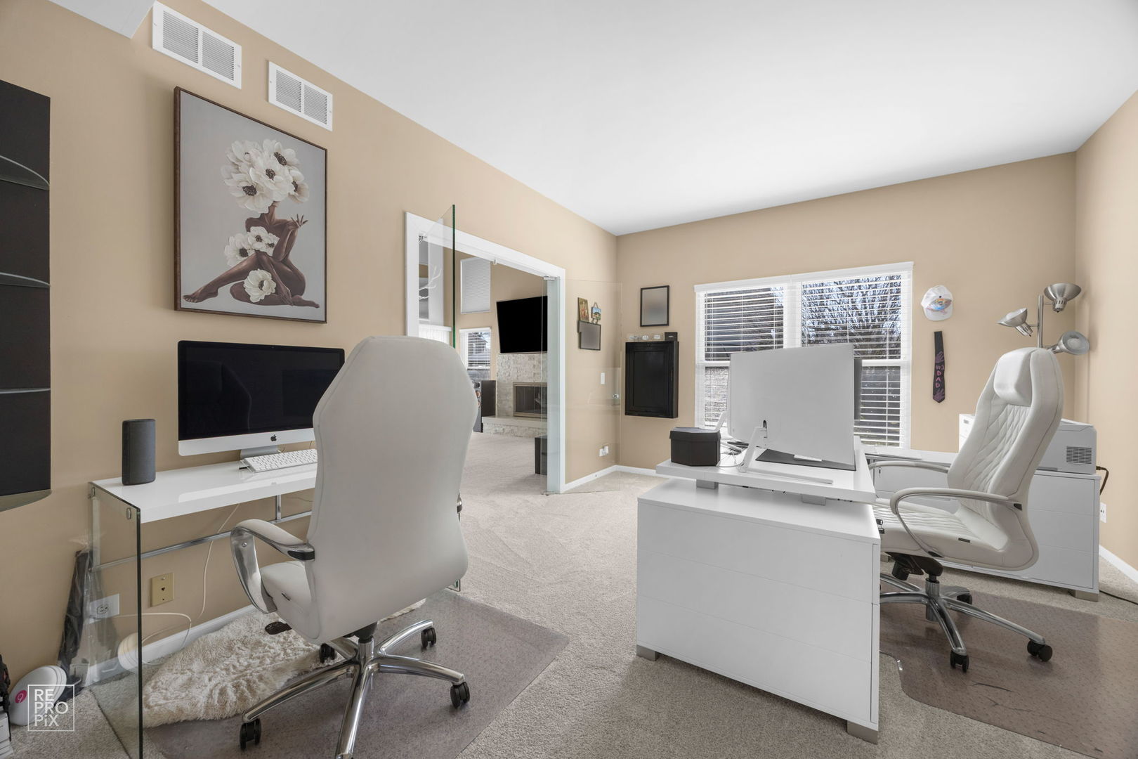 134 Timber Court Gilberts, IL 60136 - Photo 14 of 35 a view of a workspace with furniture and a flat screen tv