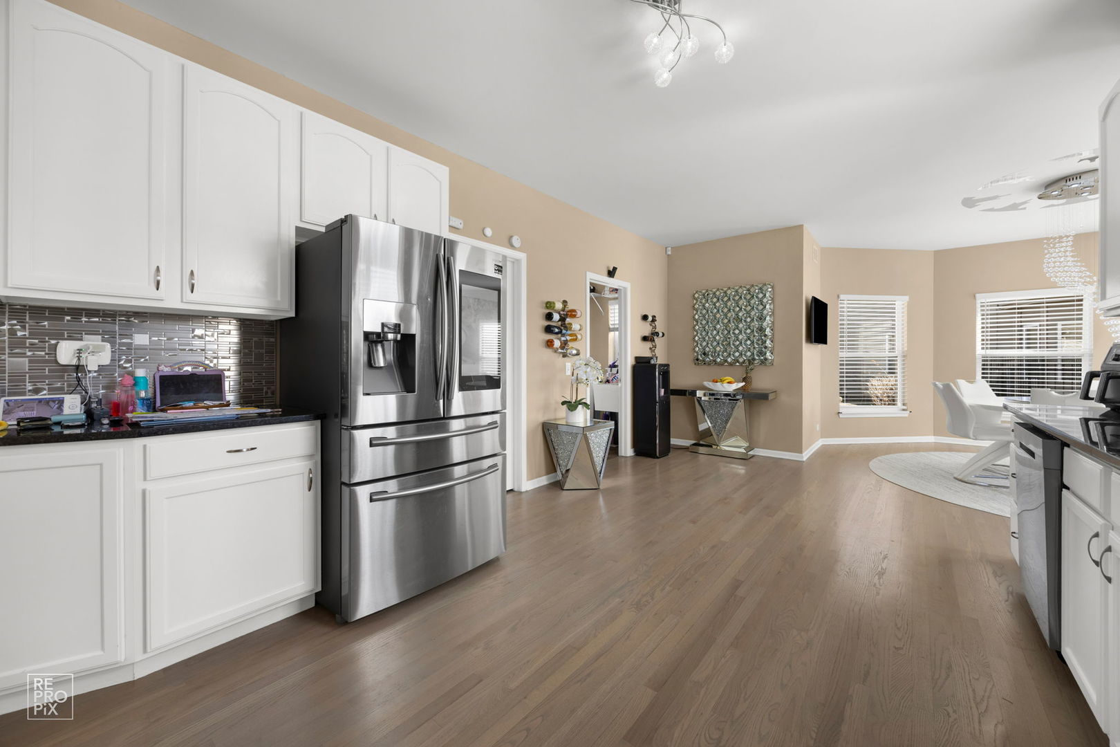 134 Timber Court Gilberts, IL 60136 - Photo 2 of 35 a kitchen with stainless steel appliances a refrigerator sink and cabinets