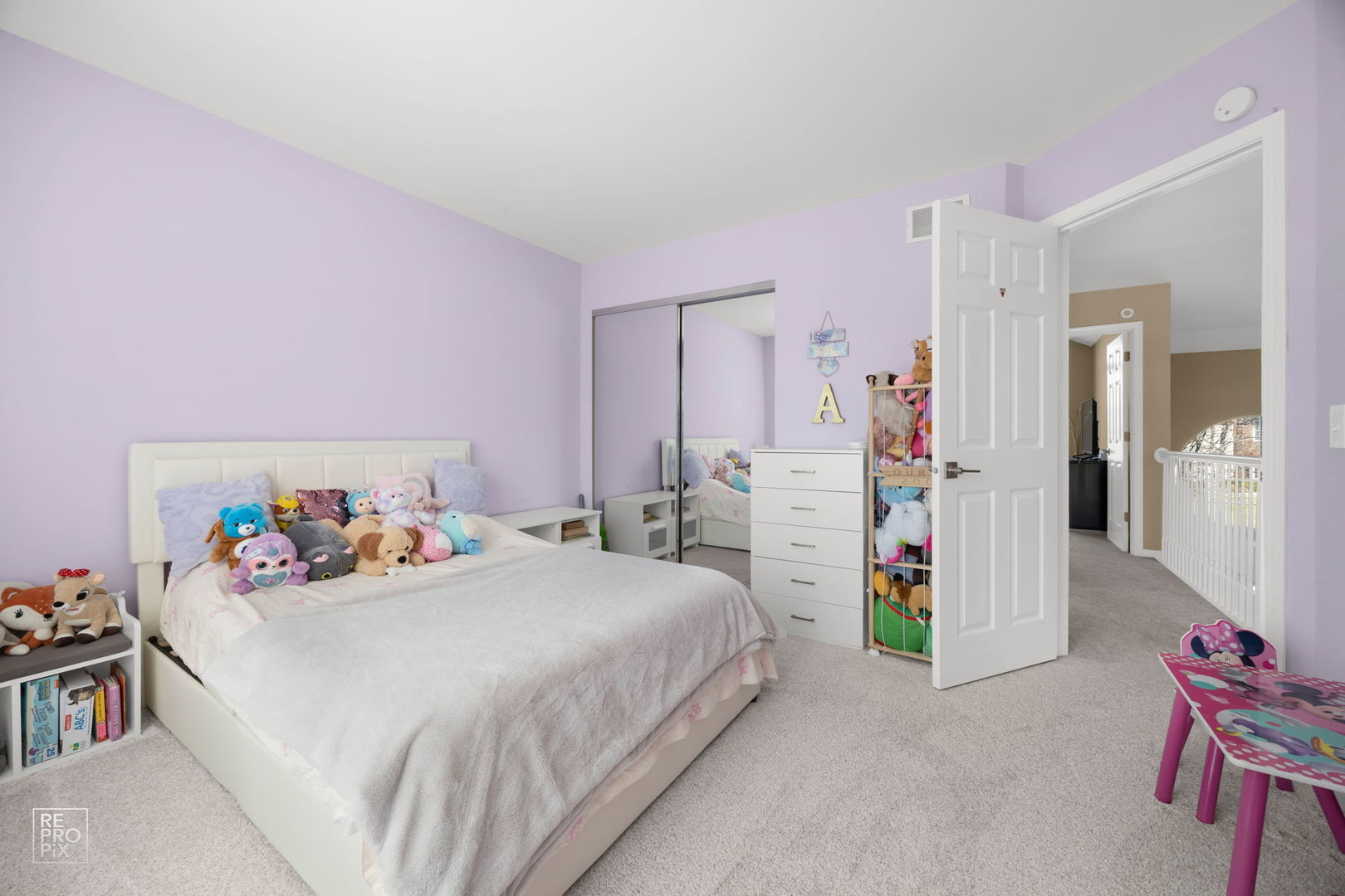 134 Timber Court Gilberts, IL 60136 - Photo 22 of 35 a bedroom with a bed and a chandelier