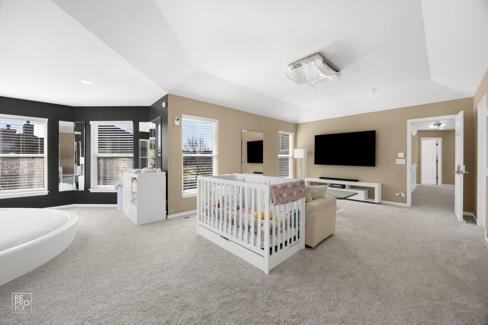 134 Timber Court Gilberts, IL 60136 - Photo 24 of 35 a view of a livingroom with furniture and a flat screen tv
