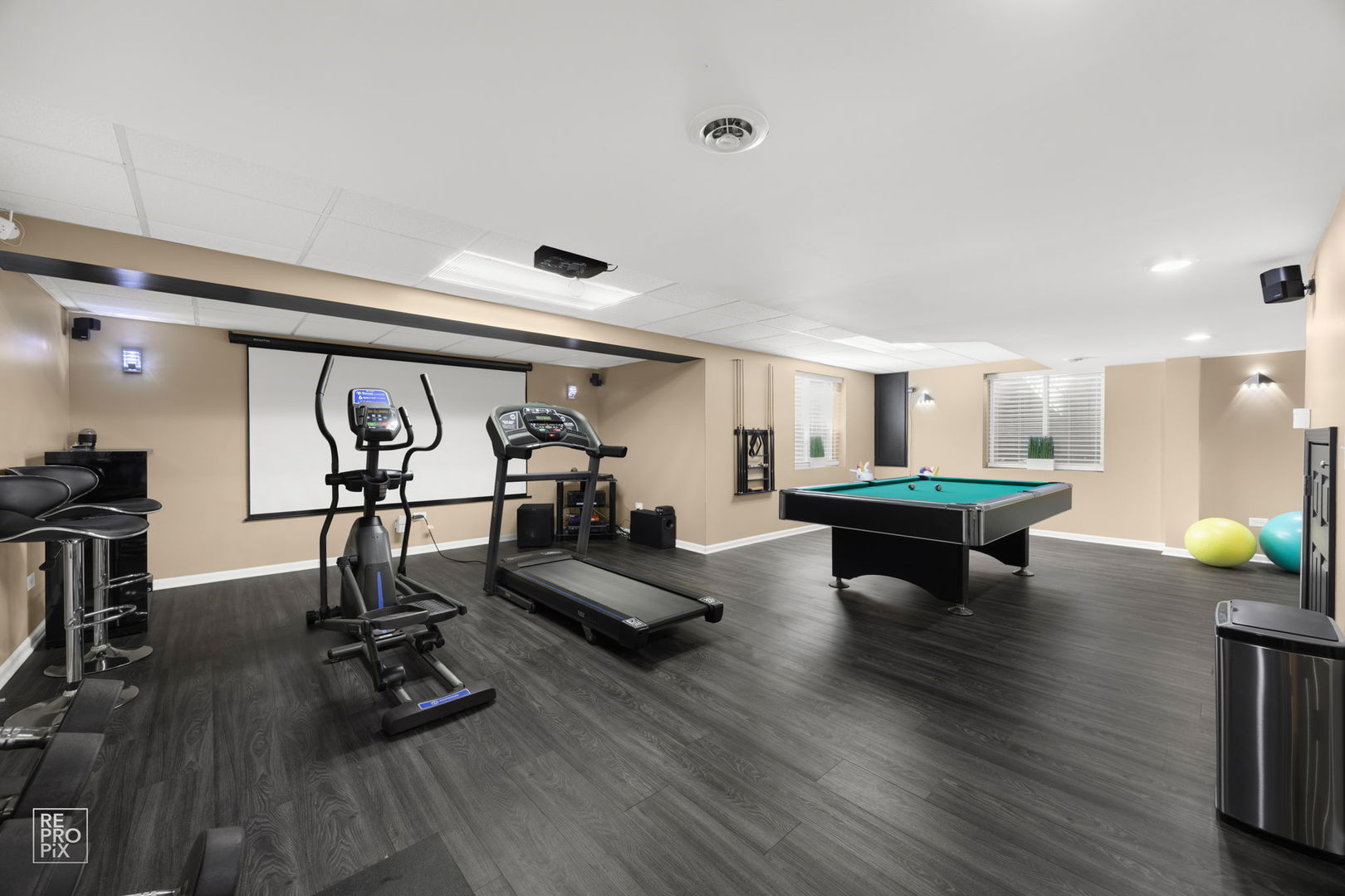 134 Timber Court Gilberts, IL 60136 - Photo 29 of 35 a view of a room with gym equipment and wooden floor