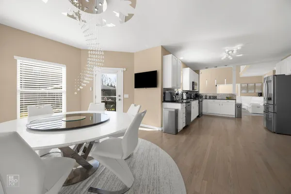 a kitchen with stainless steel appliances kitchen island granite countertop a sink and cabinets