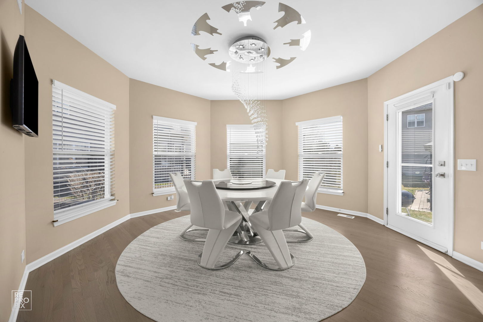 134 Timber Court Gilberts, IL 60136 - Photo 8 of 35 a view of a dining room with furniture wooden floor and chandelier
