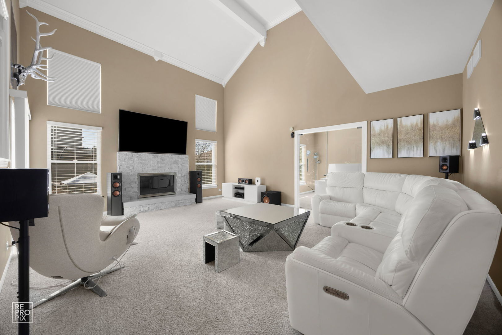 134 Timber Court Gilberts, IL 60136 - Photo 9 of 35 a living room with furniture a flat screen tv and a fireplace