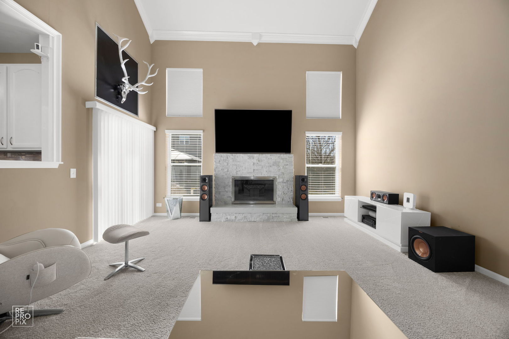 134 Timber Court Gilberts, IL 60136 - Photo 10 of 35 a living room with furniture a flat screen tv and a fireplace