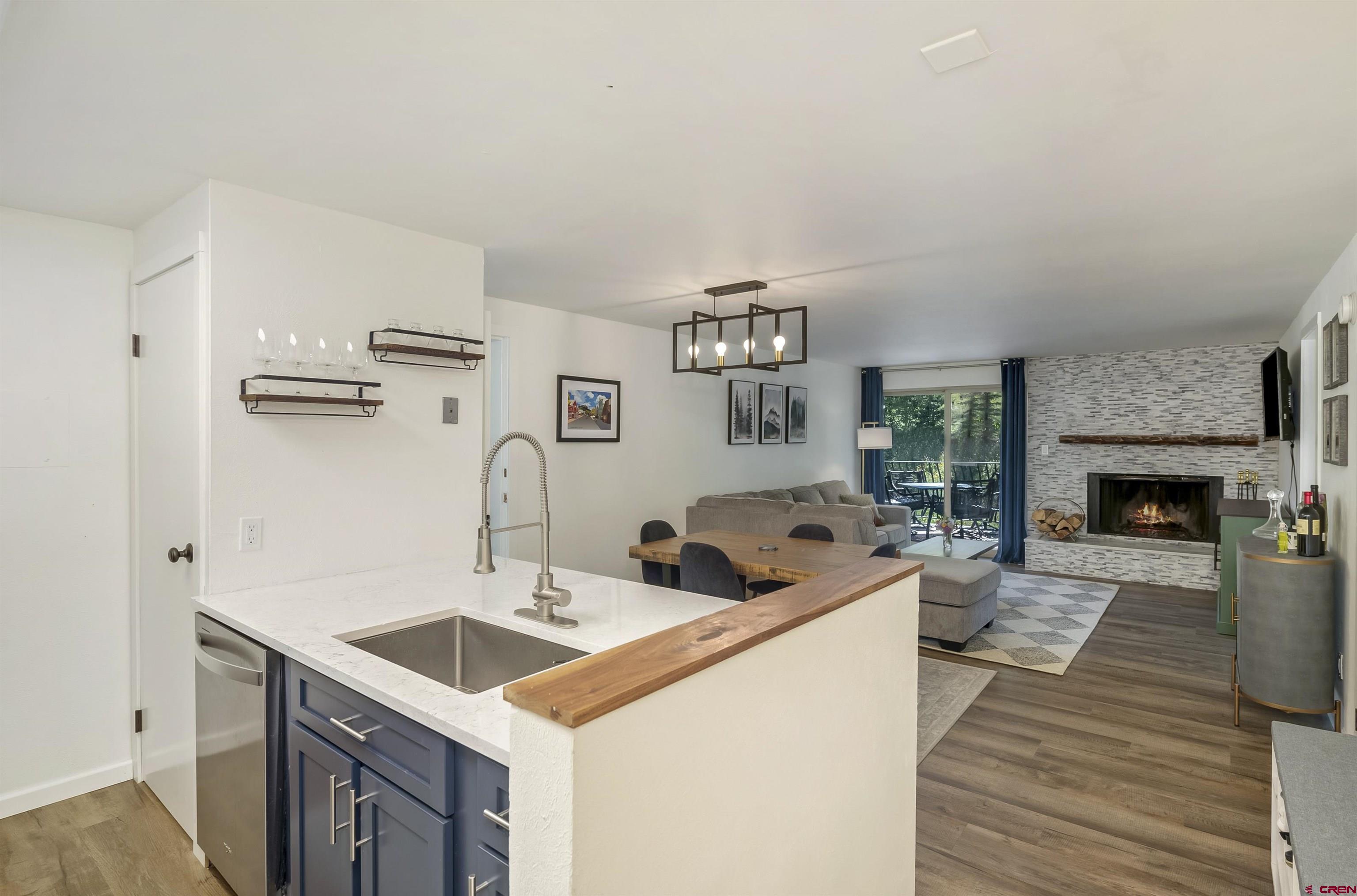 651 Gothic Road, Unit 511 Crested Butte, CO 81225 - Photo 1 of 34 a living room with furniture a fireplace and a table