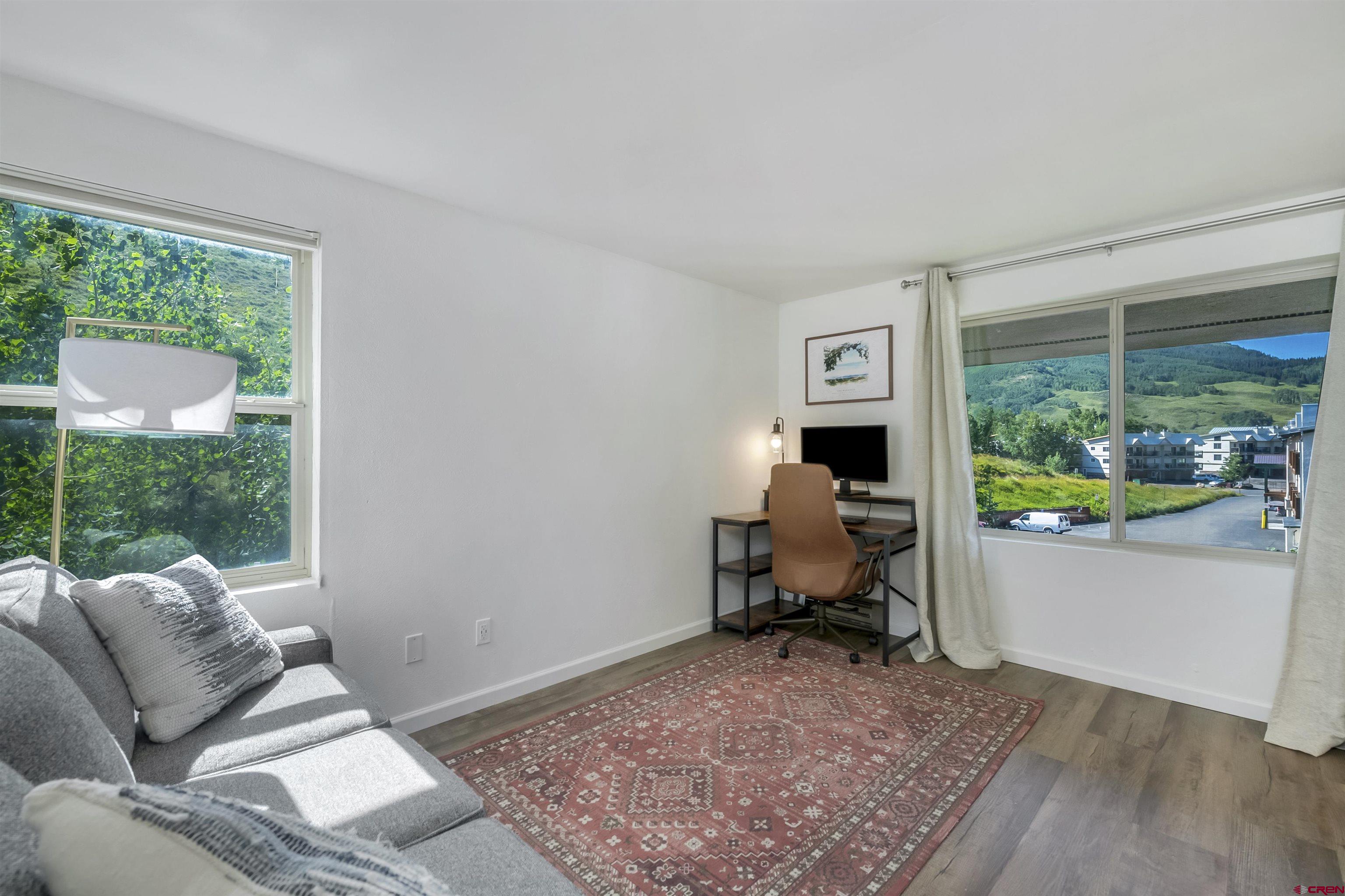 651 Gothic Road, Unit 511 Crested Butte, CO 81225 - Photo 23 of 34 a living room with furniture and a window