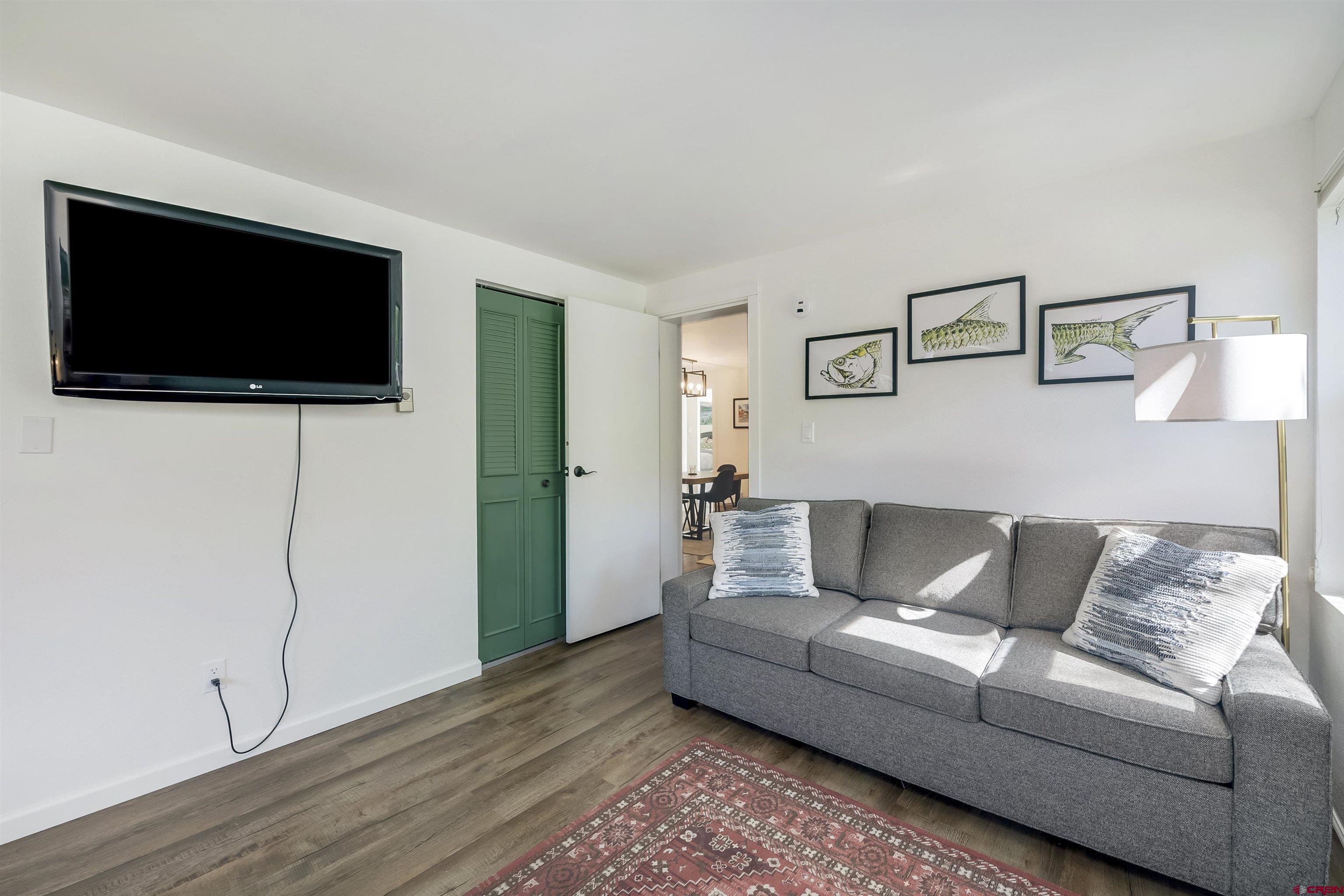 651 Gothic Road, Unit 511 Crested Butte, CO 81225 - Photo 24 of 34 a living room with furniture and a flat screen tv