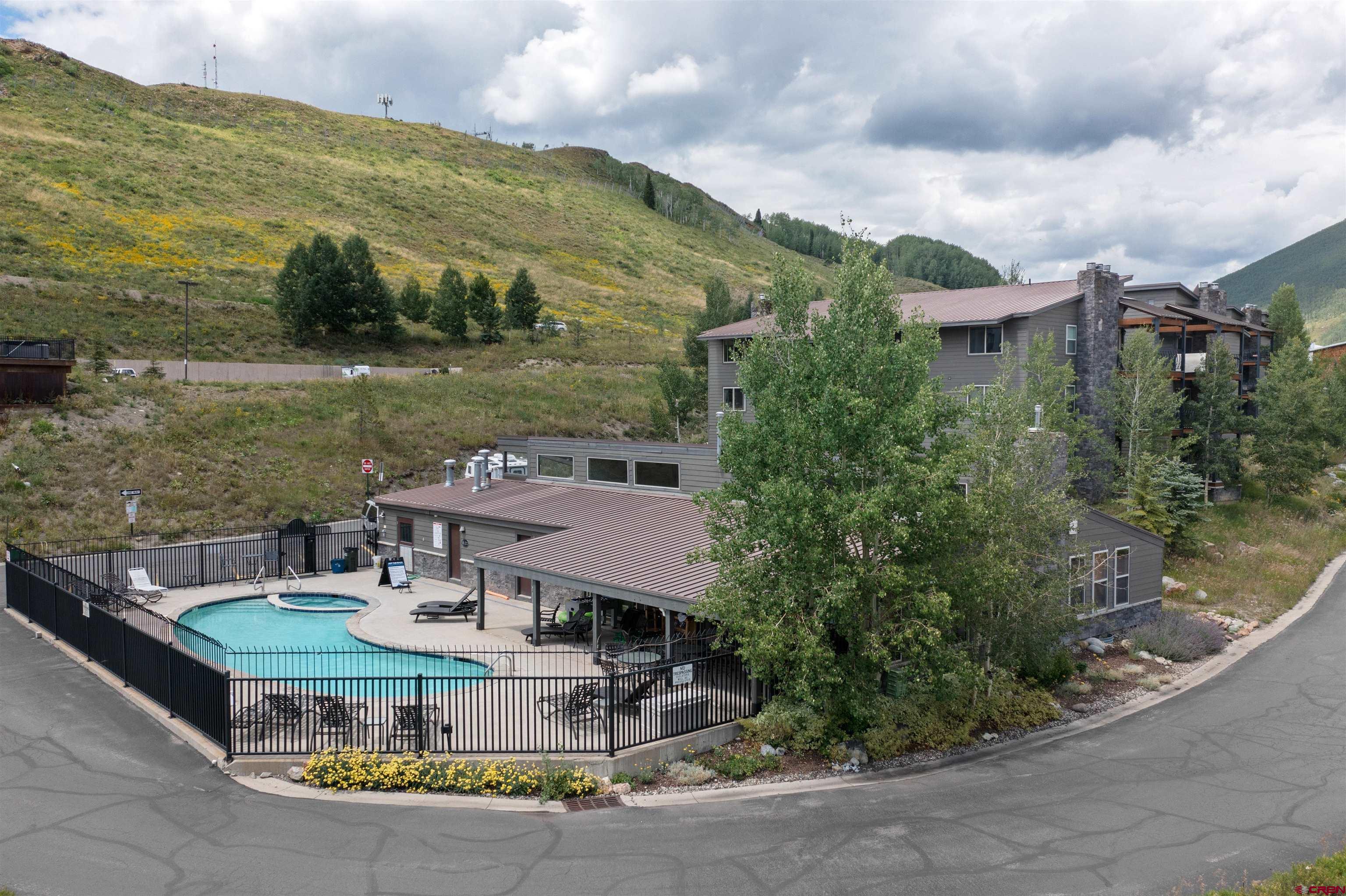 651 Gothic Road, Unit 511 Crested Butte, CO 81225 - Photo 30 of 34 a view of a lake with a mountain in the background
