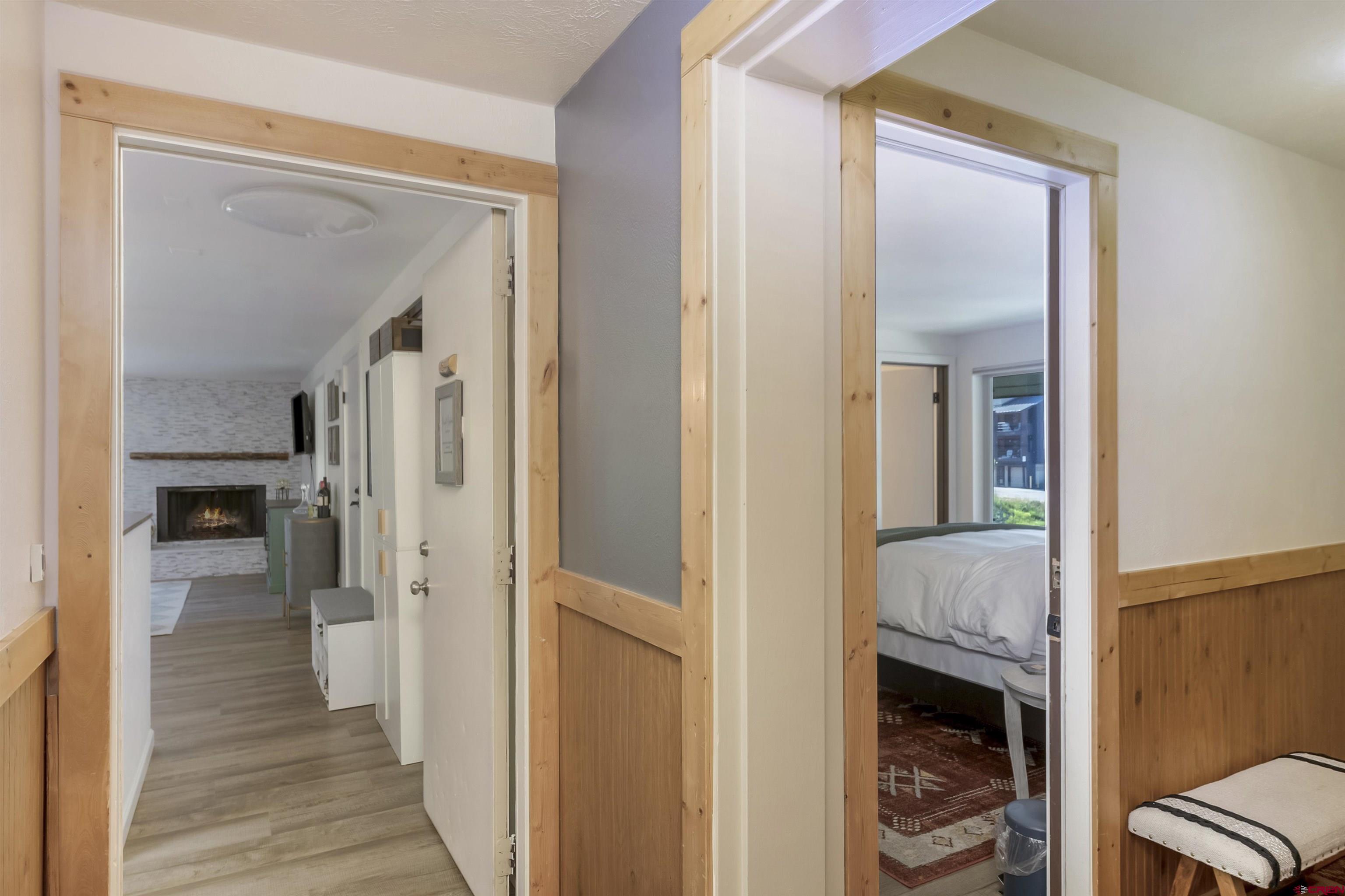 651 Gothic Road, Unit 511 Crested Butte, CO 81225 - Photo 8 of 34 a view of a livingroom with wooden floor a fireplace
