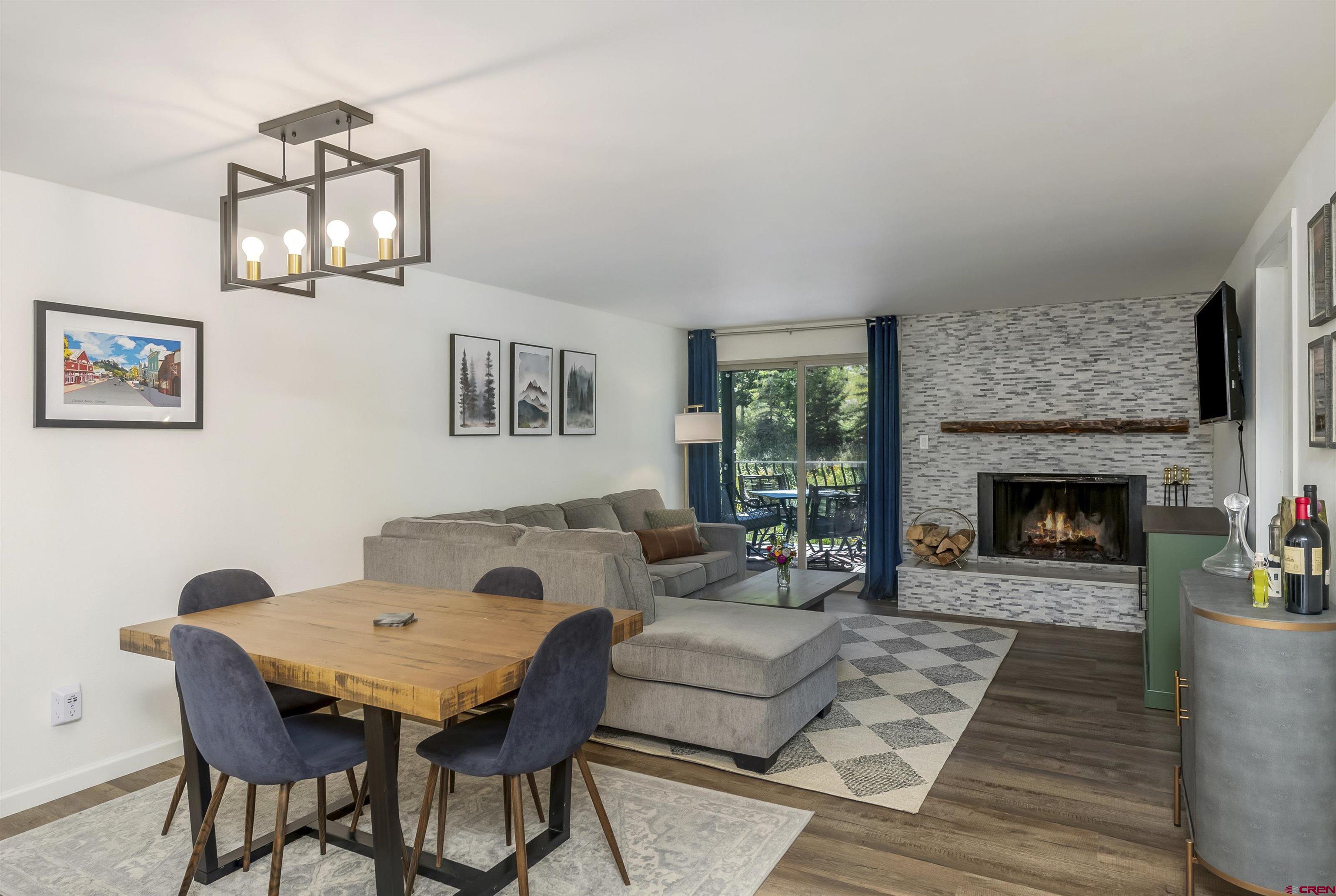 651 Gothic Road, Unit 511 Crested Butte, CO 81225 - Photo 9 of 34 a living room with furniture and a fireplace