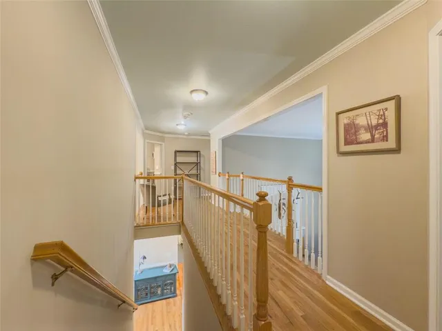 a spacious bedroom with a bed and a chandelier