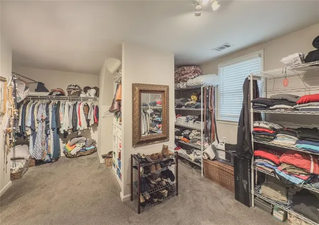 a dining room with furniture and a rug